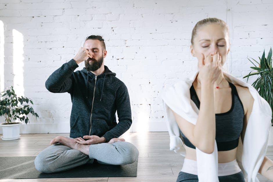 Woman in a peaceful, gentle yoga pose in a bright, airy room